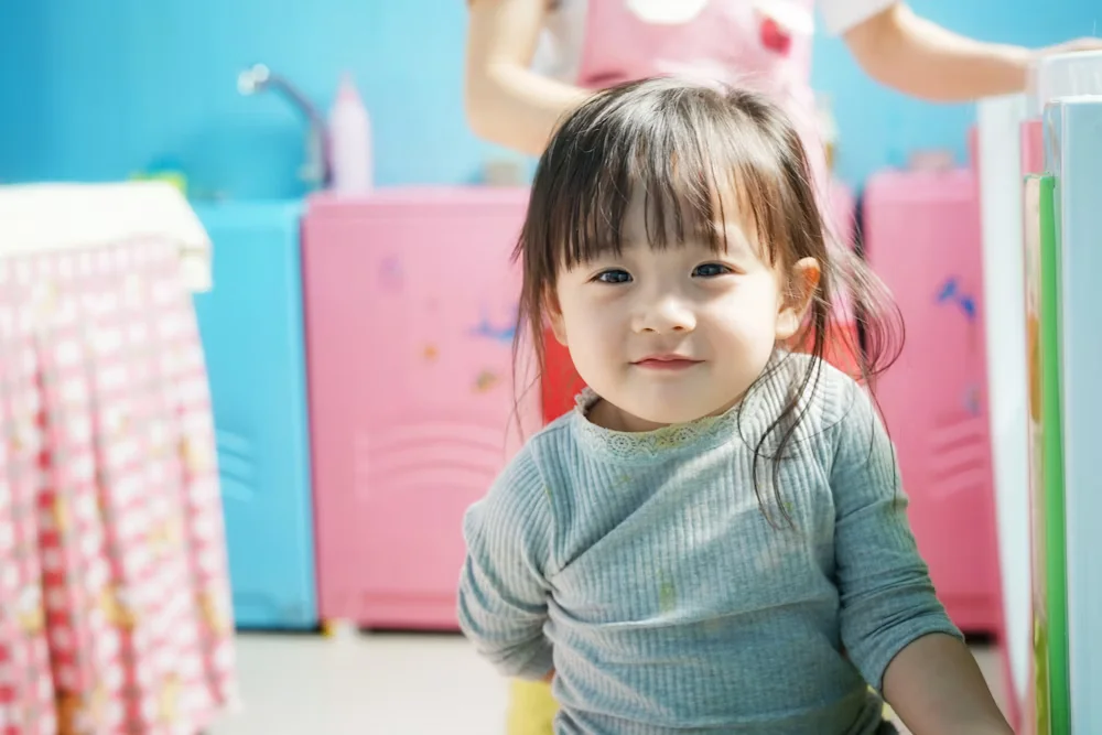 Toddler Wears Blue Long-Sleeved Shirt